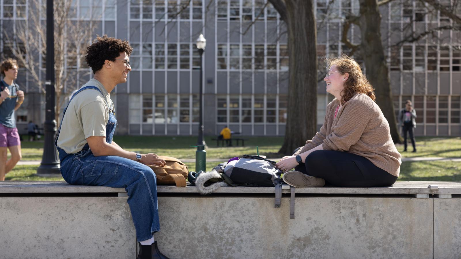 Two students talking outside